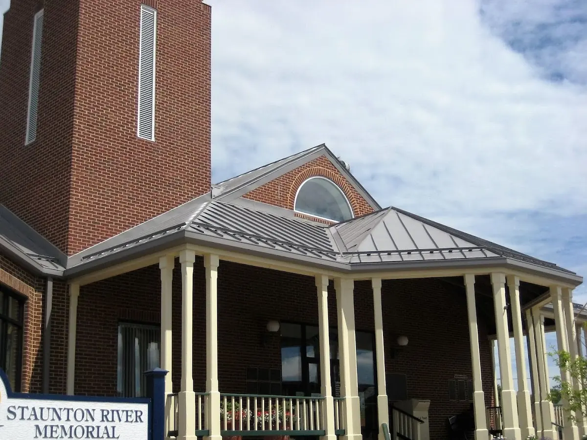 Skilled roofing craftsmen working on a residential roof in Womack Courts